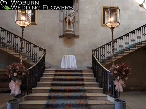 The central staircase with standard Photinia trees with Sweet Avalanche rose decoration.
