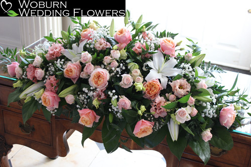 Registratrs/top table arrangement of Vuvuzela roses, Bombastic spray roses, Lizzianthus, Lillies and Gypsophillia.