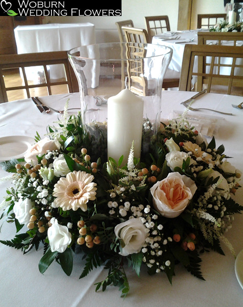 Hurricane lamp with Roses, Germini, Hypericum, Gypsopillia and Astilbe