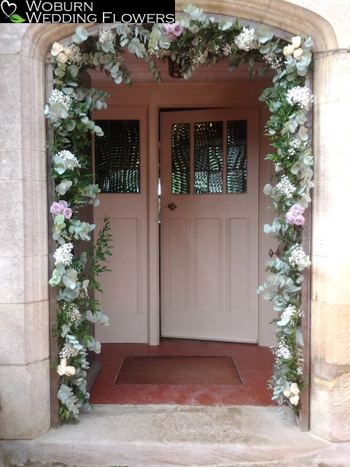 A flower arch of Eucalyptus, Gypsophillia and Roses at the entrance to Plum Park.