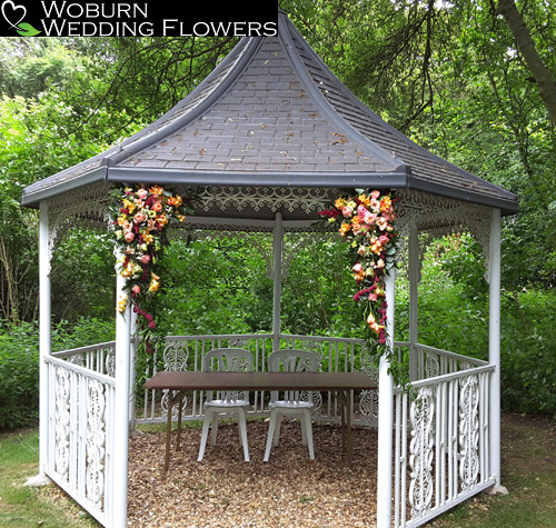 Rose, Freesia, Amaranthus, Lizzianthus and Astilbe hanging arrangements at the Milling Barn.