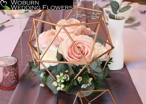 Rose and Eucalyptus rose gold geometric table arrangement.