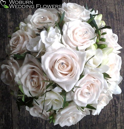 Rose and double Freesia hand tied bouquet.