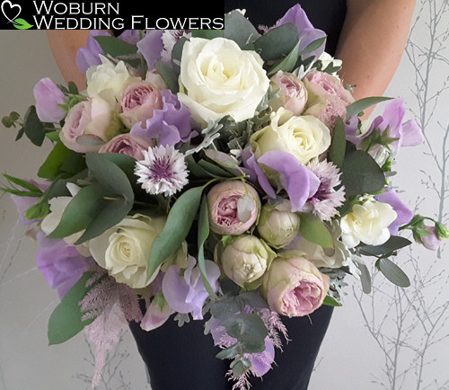 An English summer hand tied including locally grown sweet peas and cornflowers.