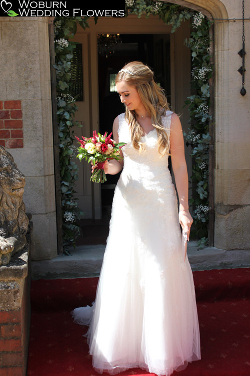 Delicate hand tied bouquet outside the main entrance to Plum Park Manor.