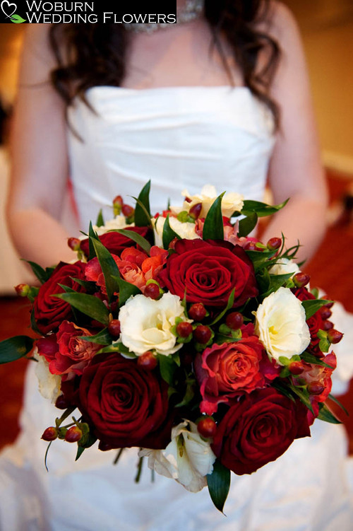 Rose, Lizzianthus, Hypericum and Freesia hand tied bouquet.