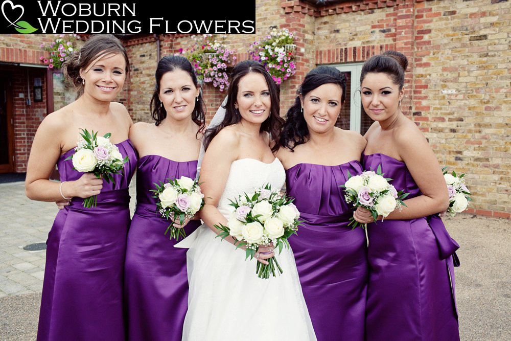 Pastel Rose bouquets to complement a rich colour scheme pictured outside Eversholt village hall.