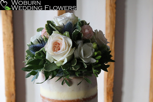 Rustic garden style cake topper for a naked cake at the Milling Barn.