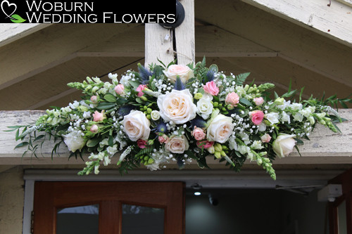 Rose arrangement above entrance