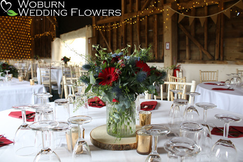 Red and blue table flowers including thistle.