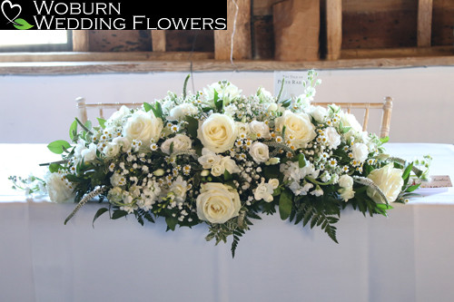 Ceremony flowers including white stocks.