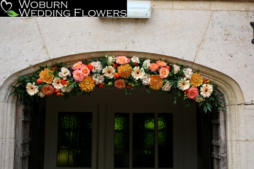 Door arch of dahlia, roses,germim, freesia, lisianthus and physalis.