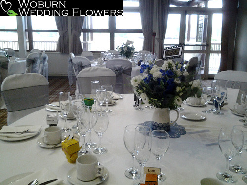 Phlox, thistle, delphinium and lizzianthus jug arrangement