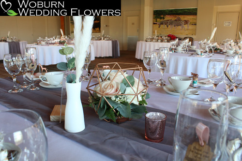 Rose, Waxflower, Carnations and Eucalyptus rose gold geometric arrangement.