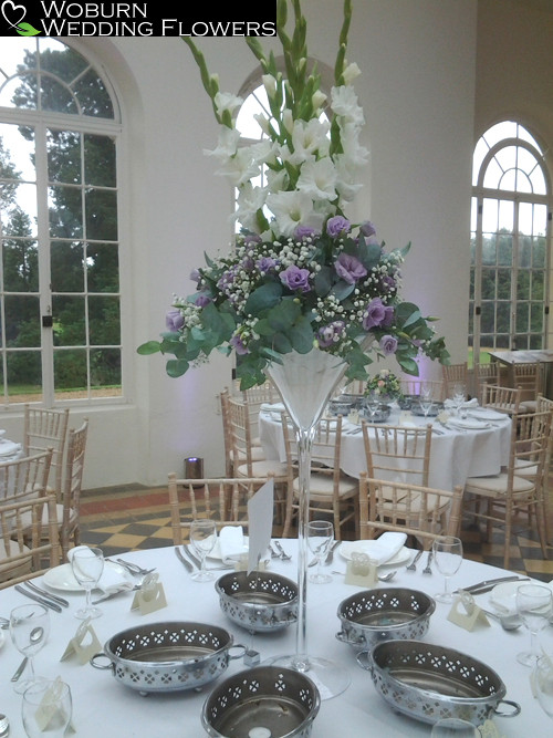 Gladioli, gypsophillia and lizzianthus martini vase arrangements.