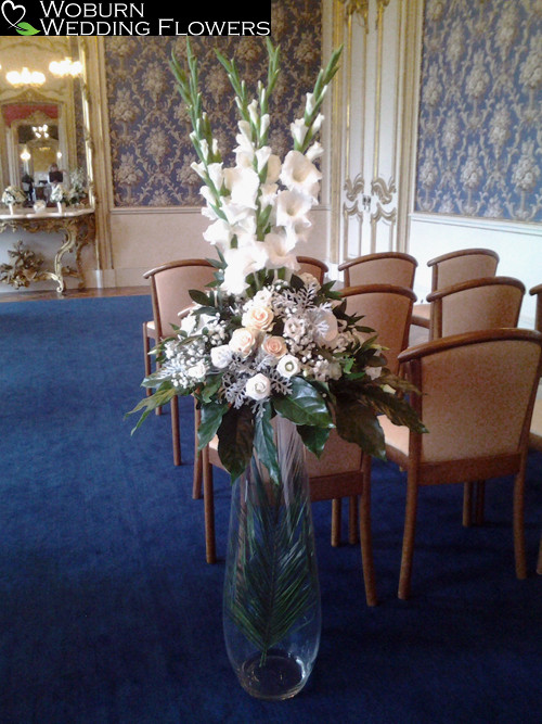 Gladioli, rose and gypsophelia aisle arrangement