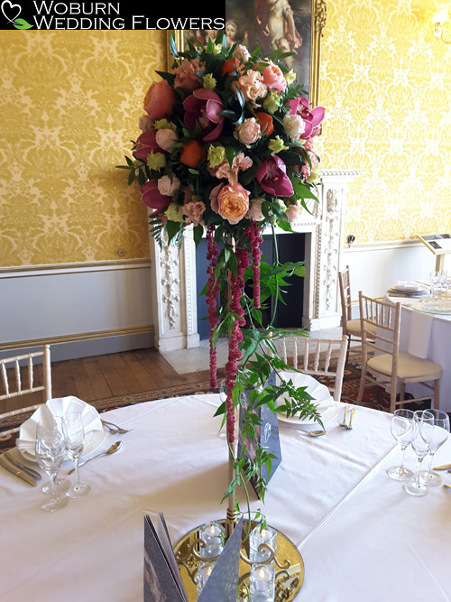 Tall stand with roses, lizzianthus and orchids