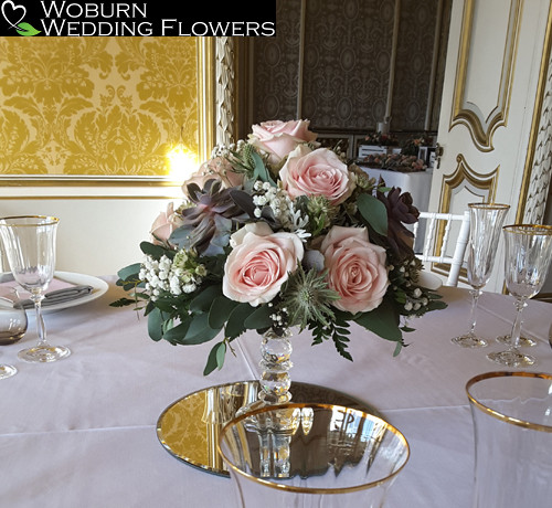 Crystal cake stand with roses, succulents and gypsophelia