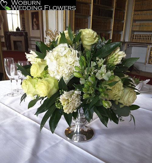 Urn arrangement of hydrangea, roses and hyacinths