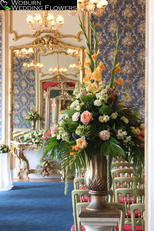 Large urn of gladioli, roses and hydrangea.